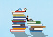 © fStop - Young man and woman reading on large stacks of books