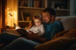 © FarisZul - Full-length photo of a young father reading a book to his little daughter at home, sitting on the sofa in a cozy living room with warm light from a lamp.