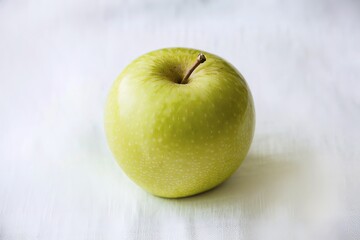 a fresh green apple placed on a white background