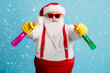 © deagreez - Portrait of his he nice attractive childish comic humorous overweight Santa cleaning up using domestic chemical like gun weapon isolated bright vivid shine vibrant blue color background