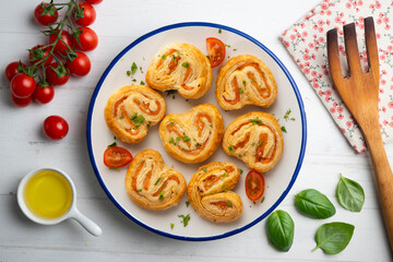 Wall Mural - Puff pastry filled with salmon and cheese. Top view table with  decoration.