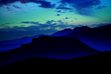 Night panorama of the Tuscan-Emilian Apennines, showcasing stunning mountain views under a starry sky, perfect for nature lovers