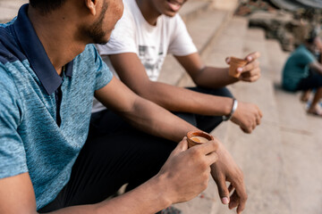 Close-up of indian man enjoying traditional chai tea outdoors