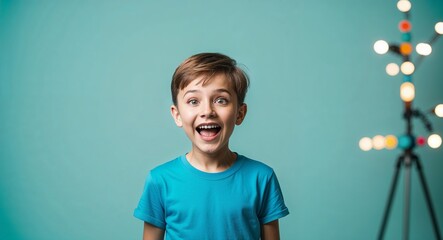 Wall Mural - Excited Caucasian boy with short hair wearing casual tshirt on plain turquoise background