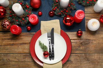 Wall Mural - Christmas place setting with festive decor on wooden table, flat lay