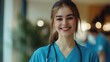 © B 7 YOU - Portrait of a smiling female doctor with a stethoscope.