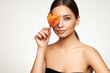 © Oleg Gekman - Portrait of beautiful young woman with autumn leafs. Healthy clean fresh skin natural make up beauty eyes and red nails