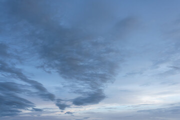 Dramatic timelapse of fluffy white clouds gathering in a blue sky, casting dark shadows as a summer storm approaches