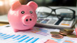 © Nova Sphere - Pink Piggy Bank on Financial Charts with Calculator and Coins