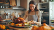 © Miljan Živković - Adult woman prepare thanksgiving dinner in modern kitchen