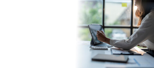 Wall Mural - businesswoman working from home office using digital tablet computer with stylus pen