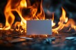 © dee-nesia - burning blank white name card on dark background