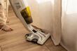 © Svetlana - Woman vacuuming parquet or laminate. Cleaning with vacuum cleaner in bedroom. Soft focus