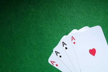 Poster - Poker game. Playing cards on green table, flat lay. Space for text