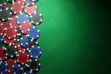 Canvas Print - Poker chips on green table, flat lay. Space for text