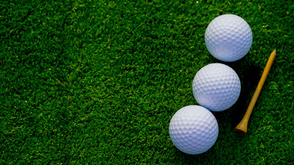 Wall Mural - Golf ball is on a green lawn in a beautiful golf course with morning sunshine.