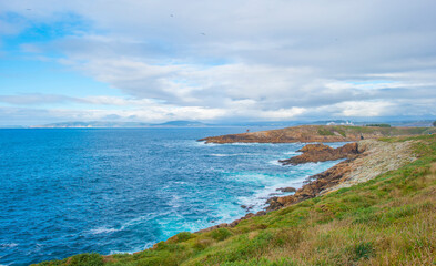 Wild shore with rocks and stones along the coast of northern Spain, Muxia, Galicia, September 12, 2024