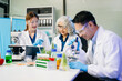 © Nuttapong punna - Food scientists in lab coats, testing samples, and analyzing food safety and quality in a modern laboratory