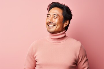 Wall Mural - Portrait of a cheerful asian man in his 40s wearing a classic turtleneck sweater in pastel or soft colors background