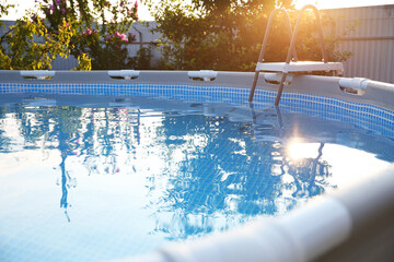 Wall Mural - Above ground swimming pool outdoors on sunny day, closeup