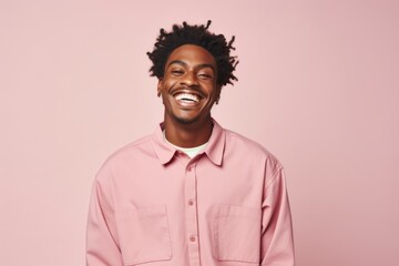 Wall Mural - Portrait of a joyful afro-american man in his 20s sporting a breathable hiking shirt over pastel or soft colors background