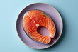 © Outkast - Raw Salmon Fillet on a Purple Plate
