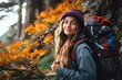 © Oratai - Backpacker leaning against a tree in a forest, focusing their camera on a close-up of colorful wildflowers
