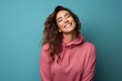 © Markus Schröder - Portrait of a blissful woman in her 30s wearing a thermal fleece pullover isolated on solid color backdrop