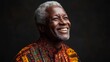 © PaulShlykov - Happy 60 year old Zambian man, on a solid background with good lighting