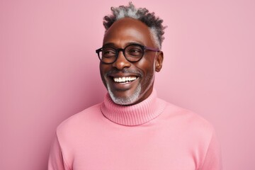 Canvas Print - Portrait of a grinning afro-american man in his 50s dressed in a thermal insulation vest over solid pastel color wall