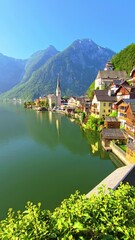 Wall Mural - experience the breathtaking view of hallstatt, austria, by the tranquil lake and majestic mountains