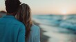 ©  Shomixer - A couple sits and relaxes on beach chairs, embracing each other while watching a beautiful sunset over the ocean, capturing a serene moment of love and companionship.