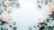 © Erika - fondo con espacio para copiar con un marco rodeado de flores en rosa claro y hojas verdes de eucalipto fondo elegante y sofisticado
