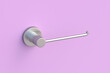 © OlekStock - Holder for toilet paper on pink wall. Bathroom accessories. 3d render