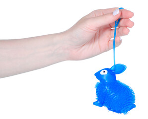 Antistress rubber bunny toy in hand isolation