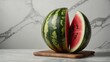 © juanpablo - watermelon on marble cutting board
