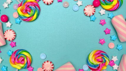 Sticker - frame of candies lollipops and chocolates on a blue background