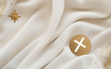 A gold cross and star on a white fabric background.