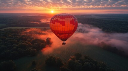 Wall Mural - Sunrise Hot Air Balloon Flight Over Foggy Forest