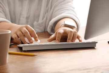 Poster - Female programmer typing on computer keyboard at her workplace in office, closeup