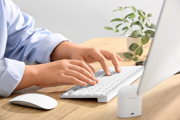 Poster - Female programmer typing on computer keyboard in office, closeup