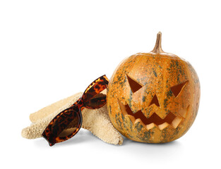 Wall Mural - Halloween pumpkin with sunglasses and starfish isolated on white background