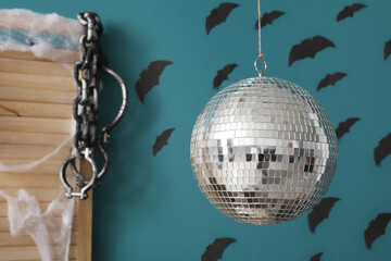 Wall Mural - Disco ball in living room decorated for Halloween party, closeup