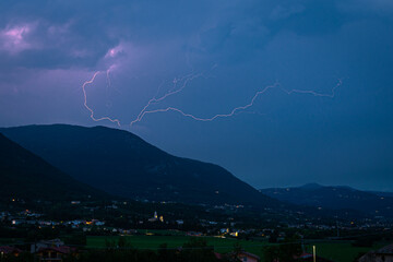 Wall Mural - lightning in the sky over the foothills of the southern european alps, north of verona, italy