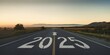 © Caspernik - Road to 2025 with an empty road with written 2025 and arrow pointing towards the horizon to represent the future and positivity and success of the new year 2025