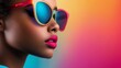 © olegganko - A woman with colorful sunglasses poses against a vibrant pink and green background during daylight