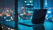 © practice  - Laptop placed on the shiny office table. City skyscrapers blurred in the background, tall buildings