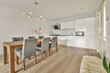 © ADDICTIVE STOCK - Modern kitchen and dining area with elegant decor