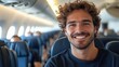 ©  Dreamy Shots - Happy man smiling inside airplane, traveling with a relaxed expression, in-flight passenger enjoying the trip, casual and comfortable, close-up portrait during a flight, carefree mood.