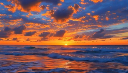 Vibrant sunset over the sea with orange hues reflecting on waves under a serene sky filled with scattered clouds, capturing natures picturesque beauty